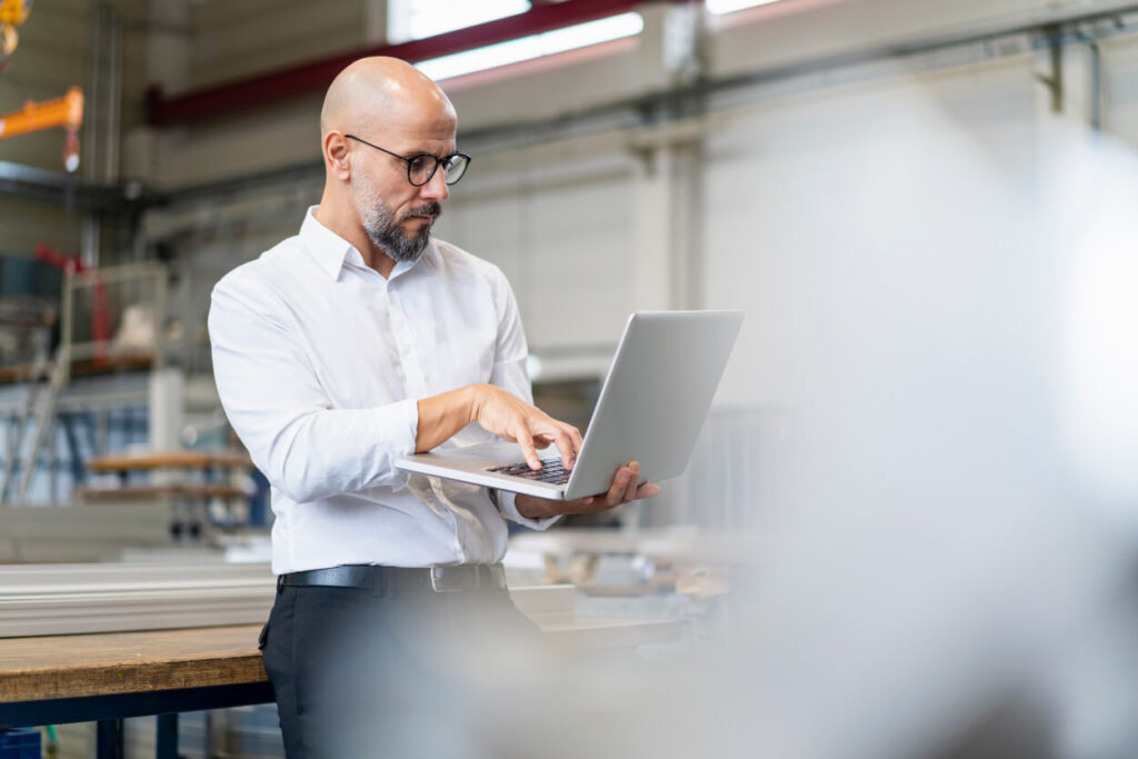 Man having a discussion over a laptop.